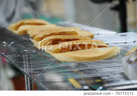 Apam balik or Malaysian Peanut Pancake turnover. Flour pancake stuffed with sugar and corn topping. Cooked using the hot pan. Famous street food in Malaysia. Apam balik or Malaysian Peanut Pancake turnover. Flour pancake stuffed with sugar and corn topping. Cooked using the hot pan. Famous street food in Malaysia. 70773172