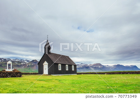 Mountain View Iceland. Beautiful black wooden church in Budir 70773349