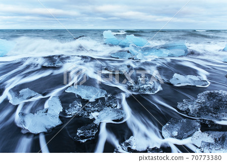 Jokulsarlon glacier lagoon, fantastic sunset on the black beach, Iceland 70773380