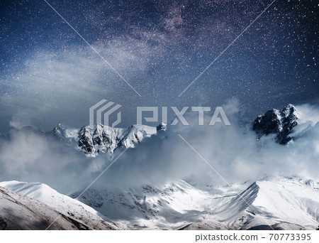 Fantastic starry sky. Thick fog on the mountain pass Goulet. Georgia, Svaneti. Europe. Caucasus mountains 70773395
