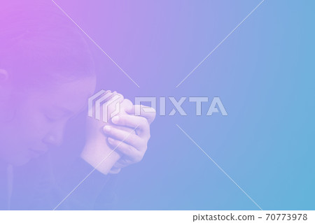 Woman's hand praying and worship to GOD Using hands to pray in religious beliefs and worship christian in the church or in general locations in vintage color tone or copy space. Woman's hand praying and worship to GOD Using hands to pray in religious beliefs and worship christian in the church or in general locations in vintage color tone or copy space. 70773978