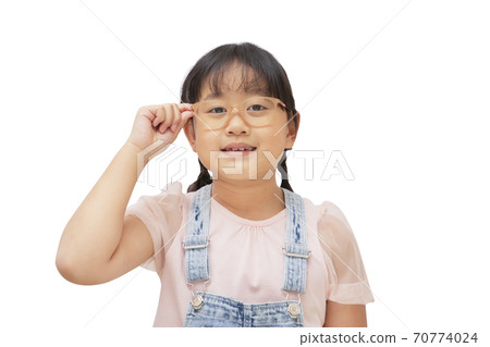 Happy little child wear glasses smiling and fun isolated over in the white background, Copy space 70774024