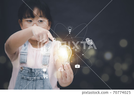 Asian Little girl touch the light bulb in graph Screen Icon of media screen,Technology Process System Business concept. 70774025