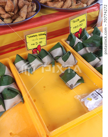 Nasi lemak. Is a signature food in Malaysia. Often eaten as breakfast. Nasi lemak is usually served with sambal, eggs and anchovies. Nasi lemak. Is a signature food in Malaysia. Often eaten as breakfast. Nasi lemak is usually served with sambal, eggs and anchovies. 70774272