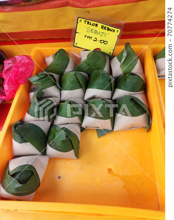 Nasi lemak. Is a signature food in Malaysia. Often eaten as breakfast. Nasi lemak is usually served with sambal, eggs and anchovies. Nasi lemak. Is a signature food in Malaysia. Often eaten as breakfast. Nasi lemak is usually served with sambal, eggs and anchovies. 70774274