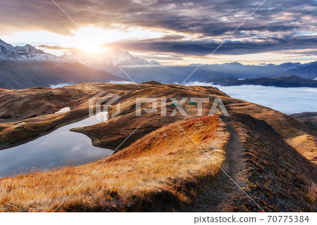 Sunset on mountain lake Koruldi. Upper Svaneti, Georgia, Europe. Caucasus mountains 70775384
