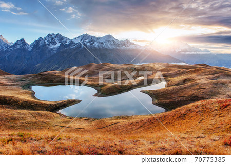 Sunset on mountain lake Koruldi. Upper Svaneti, Georgia, Europe. Caucasus mountains 70775385