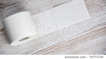 A large white toilet paper roll for use in bathrooms or kitchens, used for cleaning dirt in the bathroom background. A large white toilet paper roll for use in bathrooms or kitchens, used for cleaning dirt in the bathroom background. 70775594