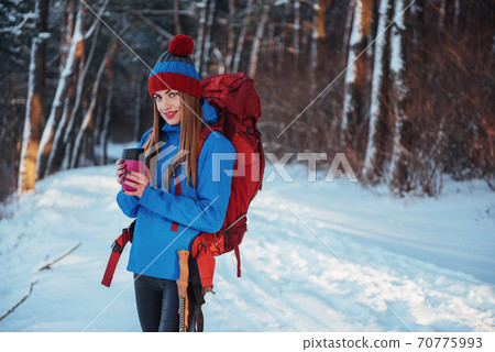 Woman Traveler with backpack hiking Travel Lifestyle adventure concept active vacations outdoor. Beautiful landscape forest Woman Traveler with backpack hiking Travel Lifestyle adventure concept active vacations outdoor. Beautiful landscape forest 70775993