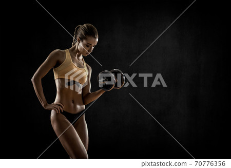 young fitness woman with dumbbells young fitness woman with dumbbells 70776356