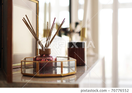 Aroma sticks with glass stand over bright background. 70776552