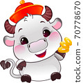 White Metal Ox with Lucky Gold Coins - Symbol of Chinese Horoscope for New Year 70778670