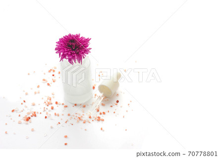 Pink flower with a pipette 70778801