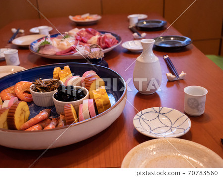 The table being set for a traditional new year's dinner in Japan The table being set for a traditional new year's dinner in Japan 70783560