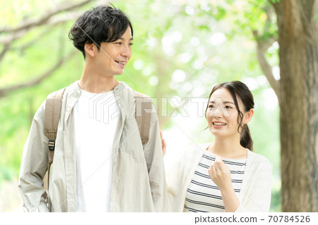Young men and women taking a walk Young men and women taking a walk 70784526