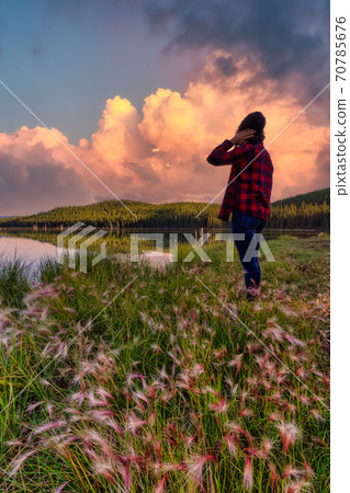 Girl Standing with Beautiful Scenery 70785676