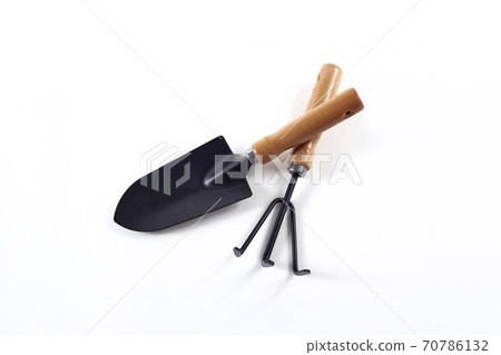 Tools garden shovel and rake isolated on white 70786132