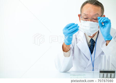 Research image: A man in a white coat Research image: A man in a white coat 70787080