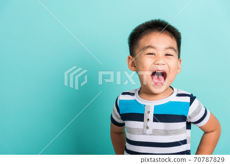 Asian portrait of cute little boy kid happy face he laughing smiles Asian portrait of cute little boy kid happy face he laughing smiles 70787829