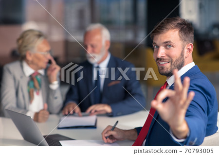 Positive aged couple consulting with insurance agent Positive aged couple consulting with insurance agent 70793005