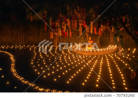 Loy Krathong festival ,Buddhist monk light candles to the Buddha in Phan-Tao Temple, Chiangmai, Thailand. 70793260