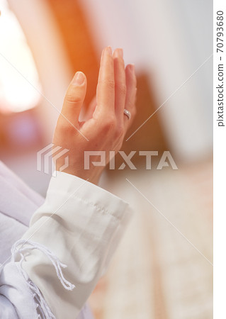 Religious muslim man praying. Islamic concept background 70793680