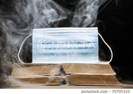 image of book mask smoke dark background  70795320