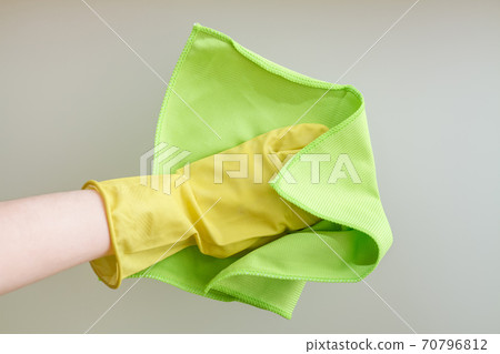Hands with a duster cleaning the glass. Closeup Hands with a duster cleaning the glass. Closeup 70796812