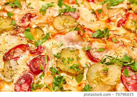 Pizza filling with pickles, bacon, sausages and cheese. Close-up, selective focus 70796835