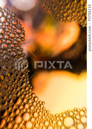 Orange water droplets background with yellow background 70798216