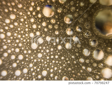 Gold water drops on bubble background Gold water drops on bubble background 70798247