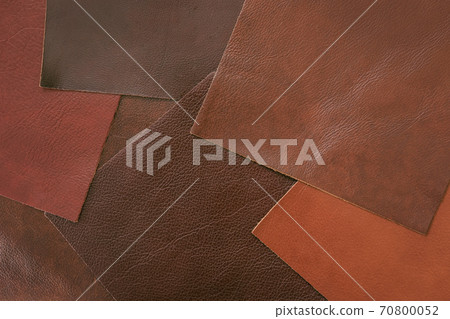 Various samples of genuine leather samples of different colors, brown shades for choice. Manufacturing concept Various samples of genuine leather samples of different colors, brown shades for choice. Manufacturing concept 70800052