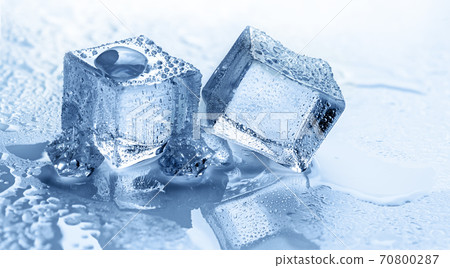 Wet ice cubes on blue background 70800287