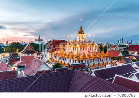 Golden metal castle illuminated, Wat Ratchanatdaram Woravihara, Loha Prasat temple in the morning at Bangkok 70800762
