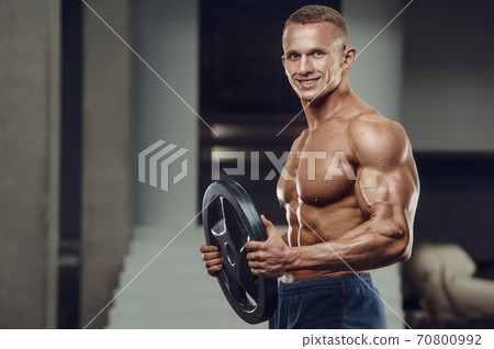 Caucasian man pumping up muscles. fitness training Caucasian man pumping up muscles. fitness training 70800992