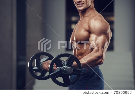 Caucasian man pumping up muscles. fitness training Caucasian man pumping up muscles. fitness training 70800993