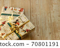 Two Christmas presents wrapped in decorative wrapping paper with a copy space for text 70801191