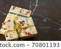 Two Christmas presents wrapped in decorative wrapping paper with a copy space for text 70801193