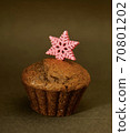 Sweet home backed chocolate muffin with pink snowflake 70801202