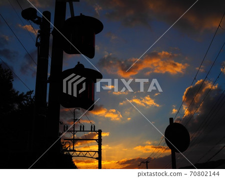 Railroad crossing and sunset Railroad crossing and sunset 70802144