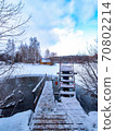 Stairs for swimming in an ice hole on the lake after a sauna on a cold day. 70802214