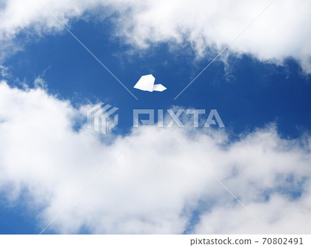 Paper airplane flying in the sky 70802491