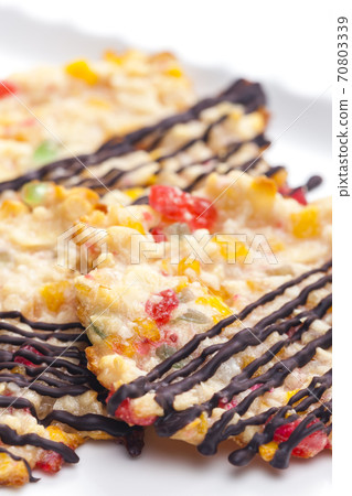 still life of cookies with candy fruit, nuts and chocolate 70803339