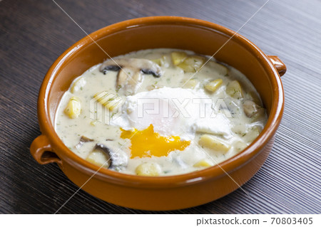 dill soup with poached egg dill soup with poached egg 70803405
