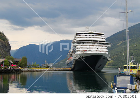 The starting point of the Sognefjord cruise between Flåm and Gudvangen, Norway, the front of a large ship anchored at the port of Flåm 2 The starting point of the Sognefjord cruise between Flåm and Gudvangen, Norway, the front of a large ship anchored at the port of Flåm 2 70803501