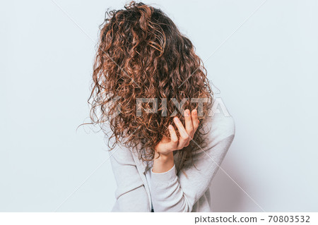 Woman wearing white shirt applying with hand Woman wearing white shirt applying with hand 70803532