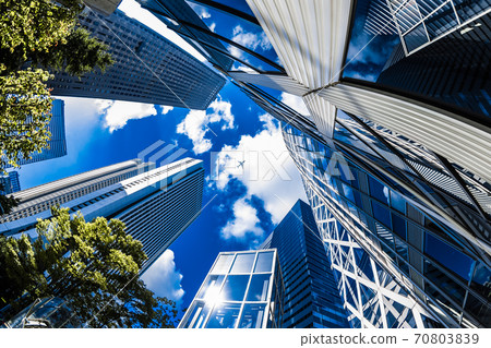 Airplane flying over skyscrapers 70803839