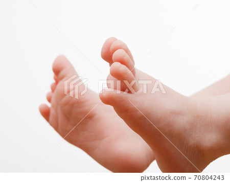Little fingers. Legs newborn baby . Baby feet . Happy family concept. Beautiful conceptual image of motherhood 70804243