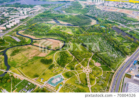 View from the height of the loshitsky Park in Minsk.Winding paths in loshitsky Park.Belarus.Apple orchard View from the height of the loshitsky Park in Minsk.Winding paths in loshitsky Park.Belarus.Apple orchard 70804326