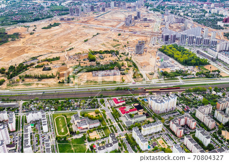 top view of the construction site and the city.The City Of Minsk.Start of new construction of a microdistrict in Minsk top view of the construction site and the city.The City Of Minsk.Start of new construction of a microdistrict in Minsk 70804327